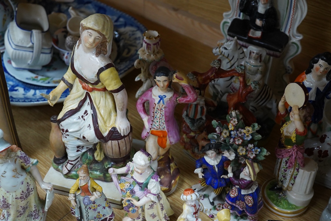 A collection of 19th century porcelain and ceramic figures, mostly Staffordshire, largest 28cm high